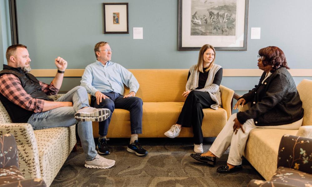 Wheaton College Graduate School students chatting on 5th floor of Billy Graham Hall