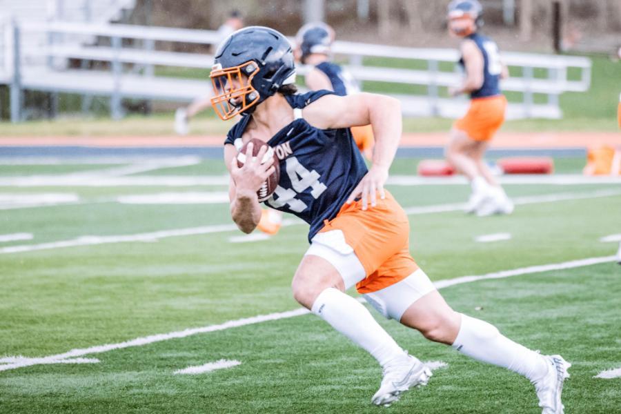 Wheaton Thunder Football Player Running with Ball