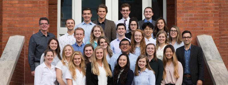 Innovation Scholars and Staff standing on Jenks Hall stairs