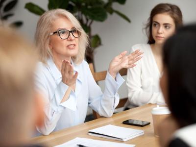 Female Professional Talking at a Table