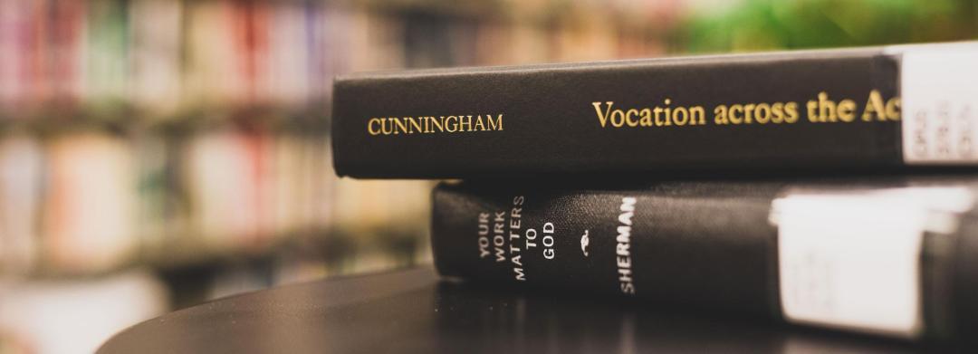 Two stacked books on a table