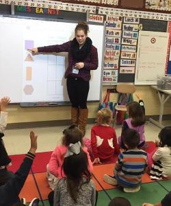 teacher at the smart board in front of class