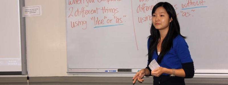 female teacher at the white board