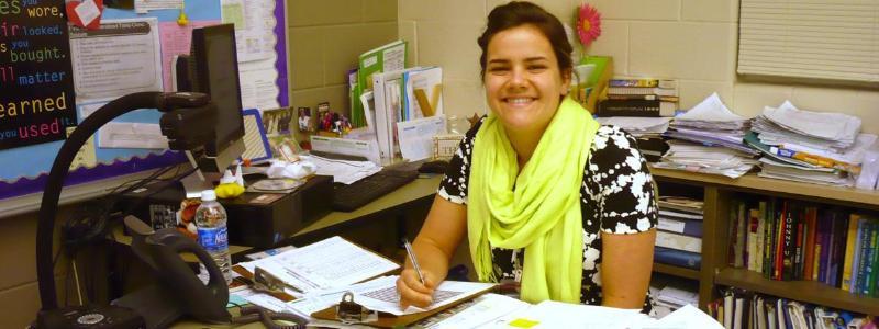 teacher working at desk