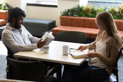 Students reading the Bible at a table