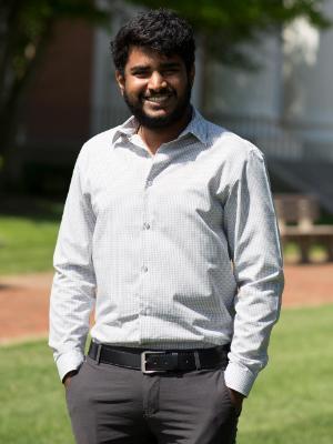 Student standing outside smiling