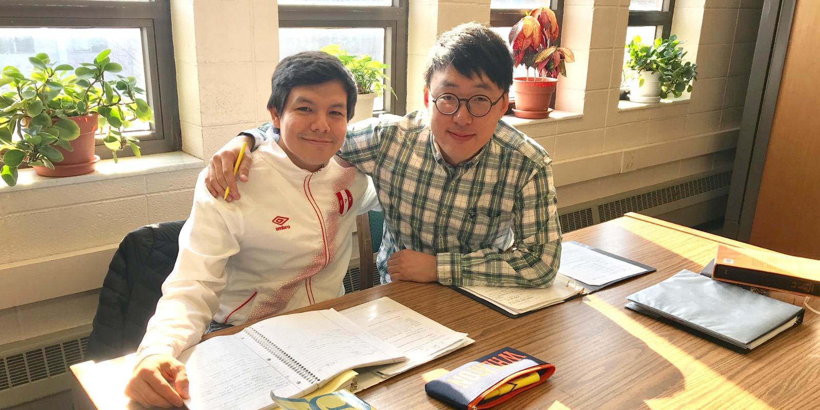 Two students studying in the Buswell Library