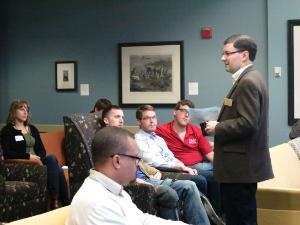 A professor giving a talk in front of students