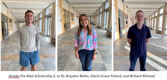 3 students in building lobby