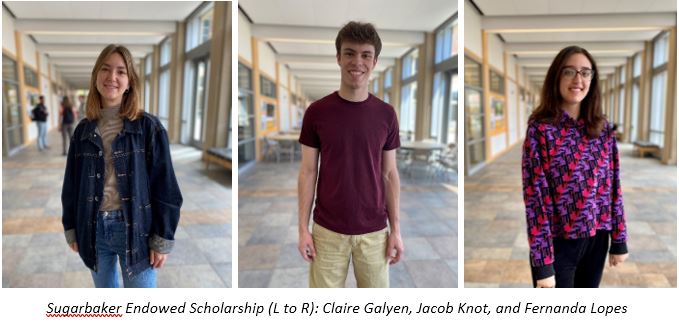 3 students standing in lobby