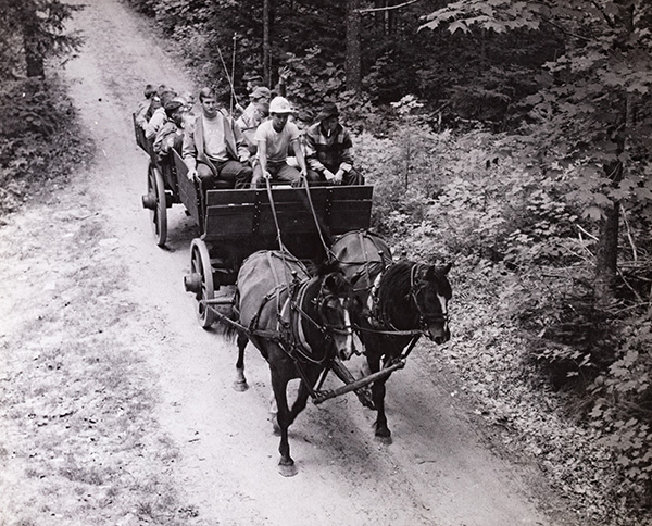 Several people sit in the carriage