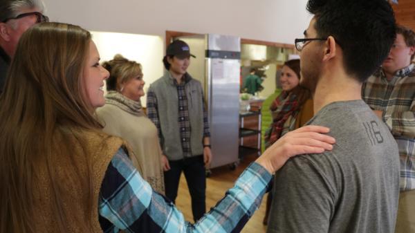 Vanguards and families talking on Thanksgiving at HoneyRock, Three Lakes WI