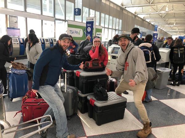 OAL graduate students posing in airport terminal