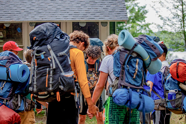 A group of campers praying