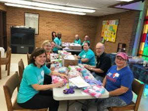 Dignity4Girls volunteers packing panties