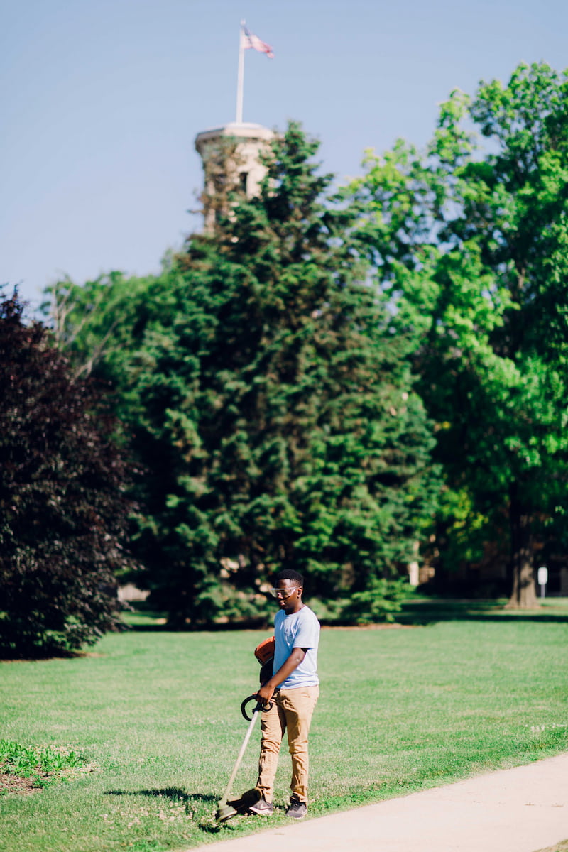 Wheaton College Landscape Operations edging grass outside Blanchard