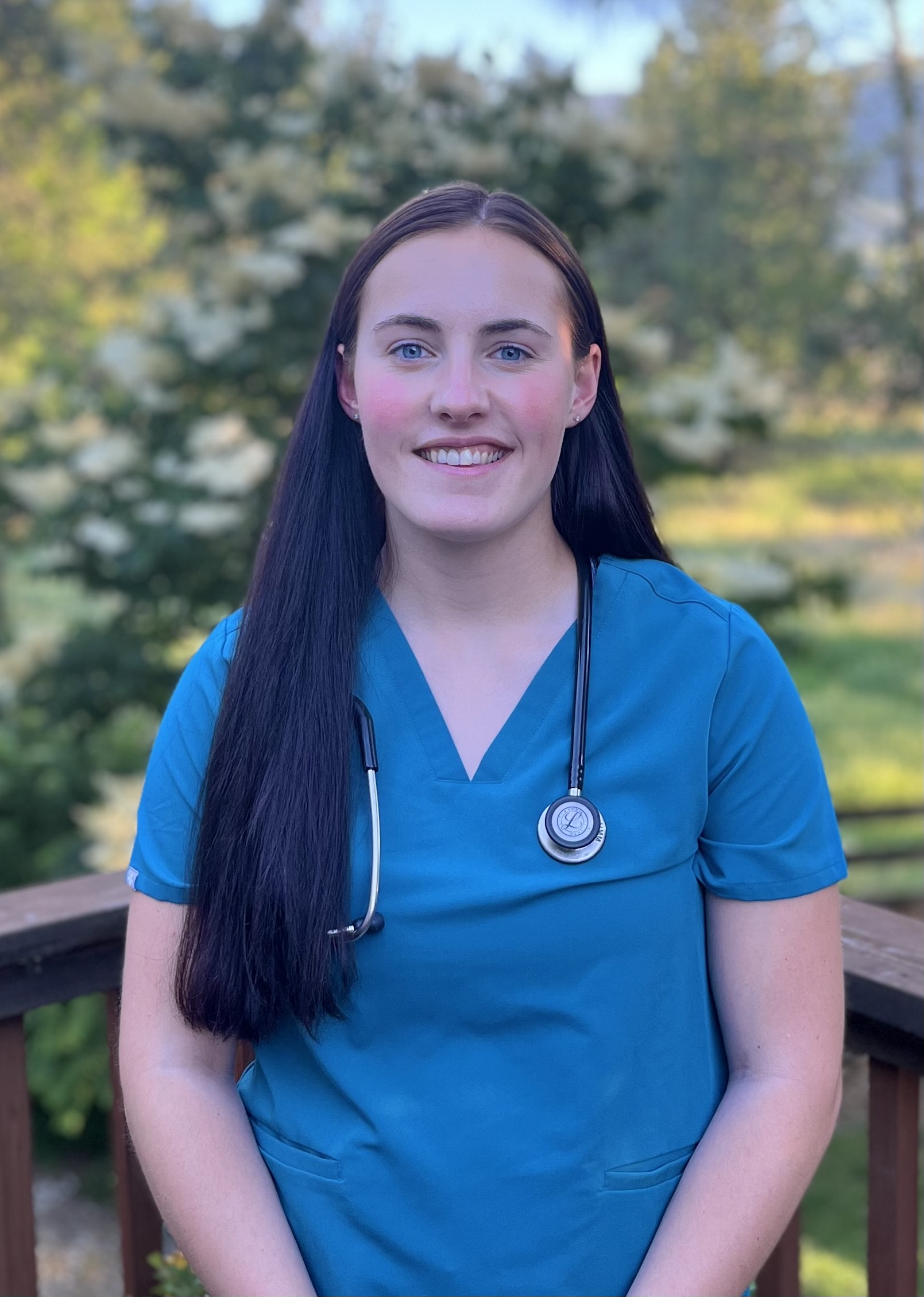 Headshot of Haley Morgan wearing blue scrubs and stethoscope