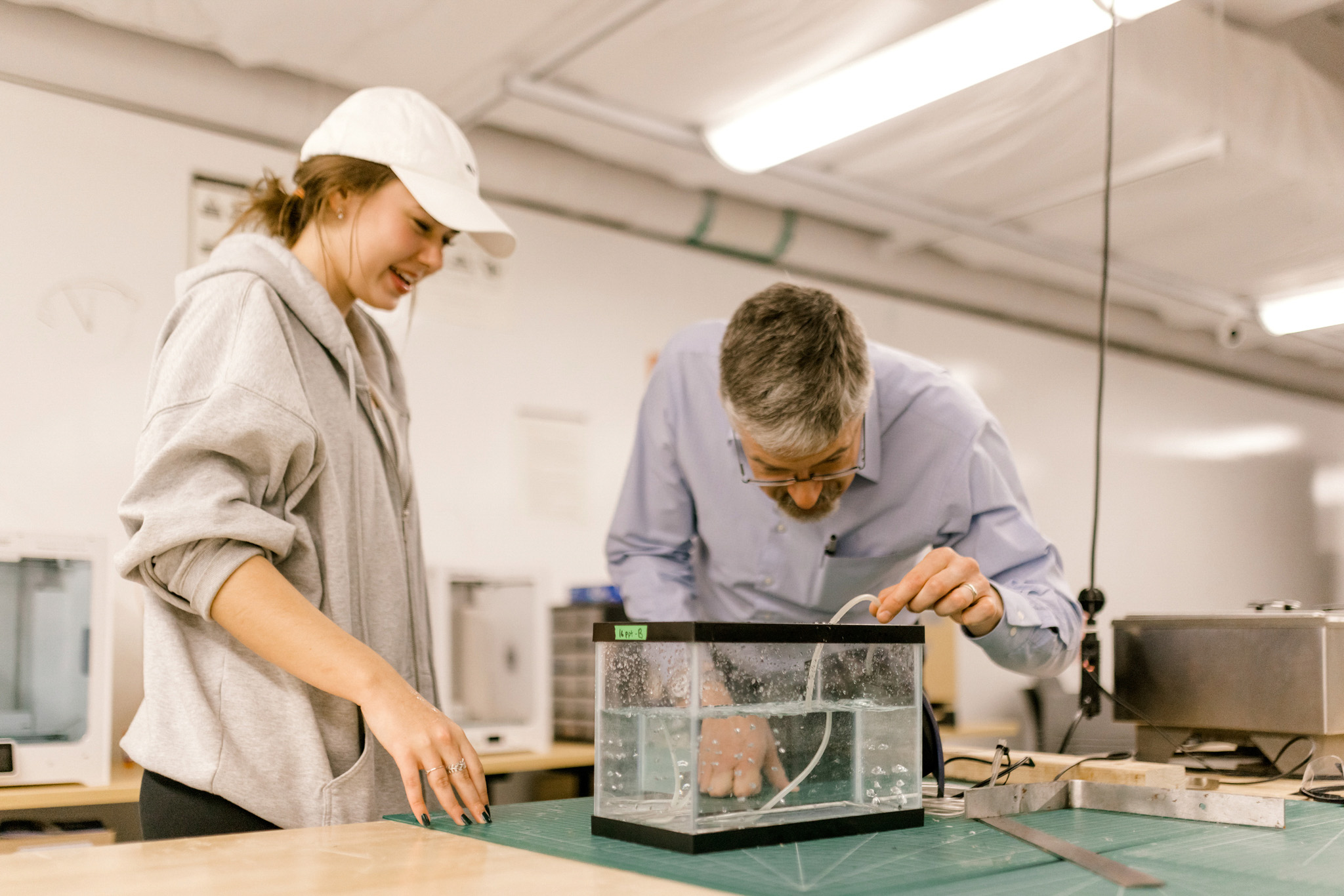 Wheaton College IL undergraduate engineering major and professor in the engineering lab