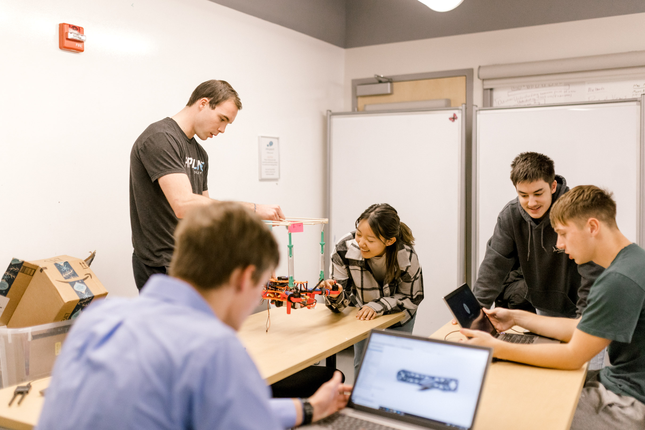 Wheaton College IL undergraduate engineering majors work on a project in the lab