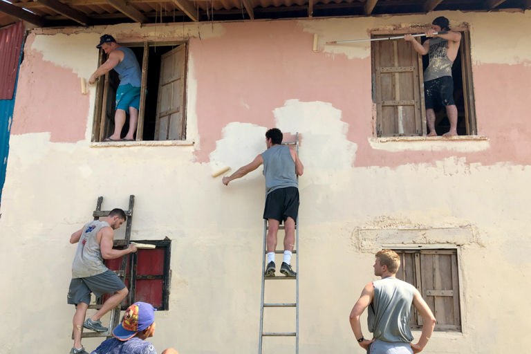 Wheaton football players painting a parsonage on the San Blas Islands, Panama in 2019.