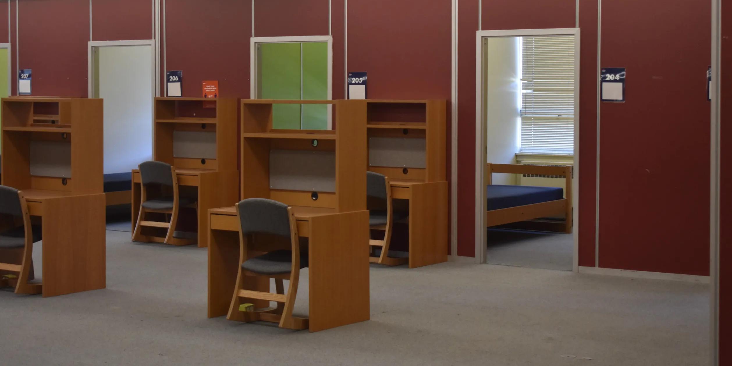 1080x540 several desks lined up in an open room