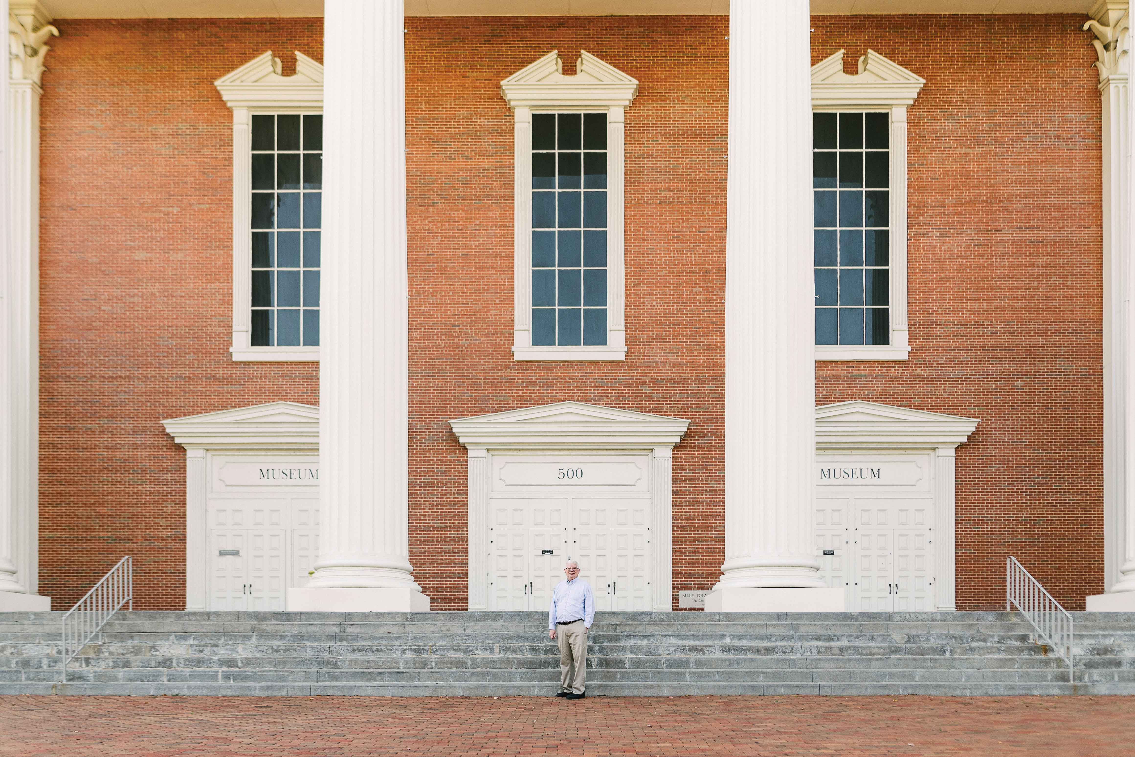 Wheaton College IL Alumnus of the Year for Distinguished Service to Alma Mater, Scott Moreau in front of Billy Graham Hall