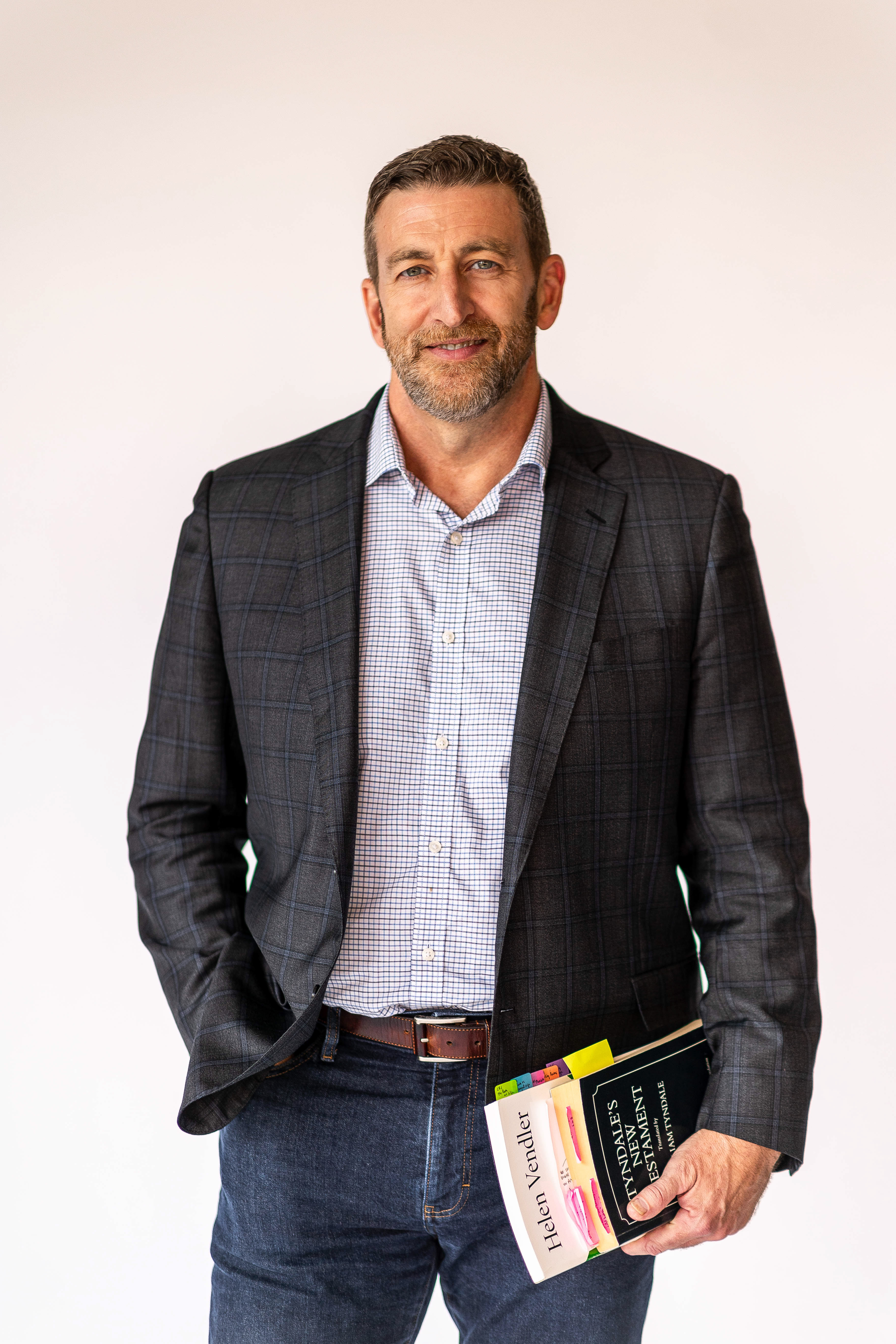Wheaton College English professor holding books