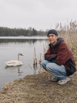 300x400 Elliot Young sitting next to a swan