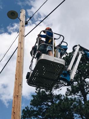 Wheaton Sustainability Students in Cherry Picker