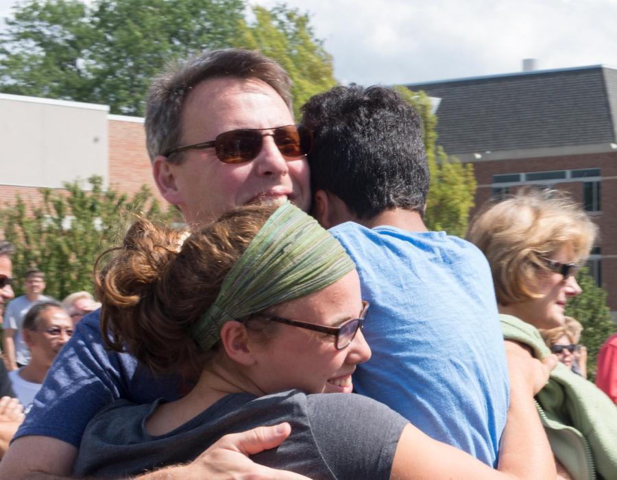 parent hugging student