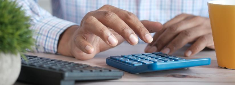 Man using calculator 825. x 300