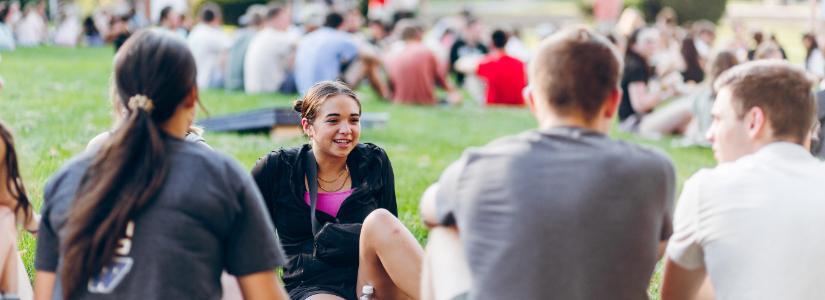 Passage 2023 Students sitting in grass 825 x 300 